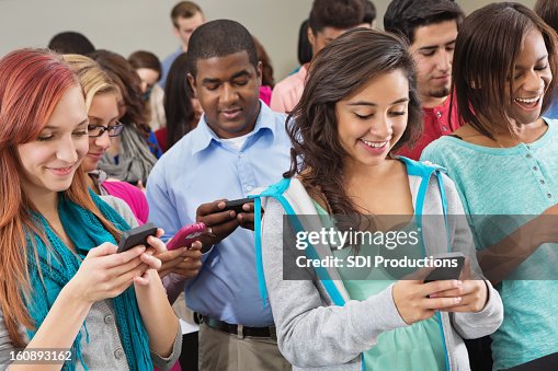 Using Phones In Colledge Group Of College Students Using Smart Phones During Event High-Res ...