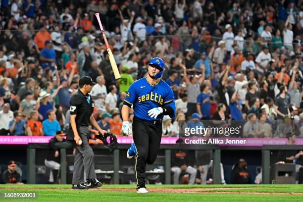 Ty France of the Seattle Mariners tosses his bat after hitting a solo home run during the fifth inning against the Baltimore Orioles at T-Mobile Park...