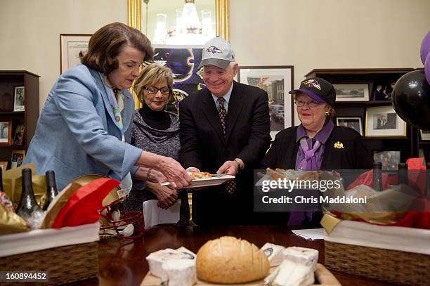 Sen. Dianne Feinstein, D-Calif.; and Sen. Barbara Boxer, D-Calif.; pay off a Supr Bowl bet with Sen. Ben Cardin, D-Md; and Sen. Barbara Mikulski,...