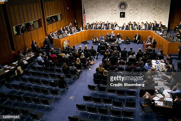 General public chairs sit empty after the room was cleared because of protestors during a Senate Select Intelligence Committee nomination hearing of...
