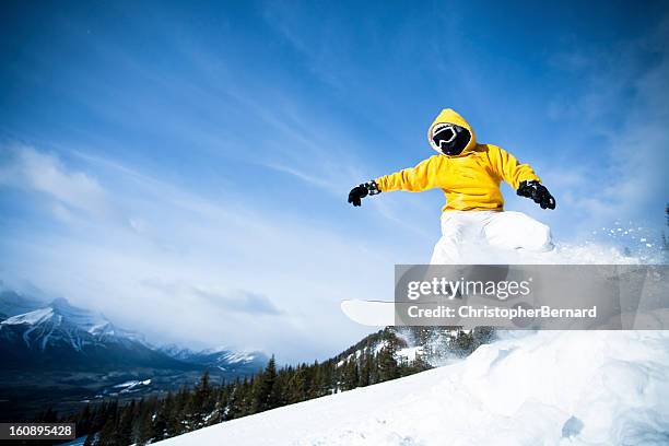 man snowboarding in the mountain - radical snowboarding stock pictures, royalty-free photos & images