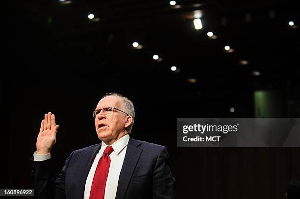 John Brennan is sworn in before testifying before the Senate Intelligence Committee hearing on his nomination to be director of the Central...