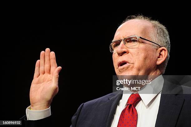 John Brennan is sworn in before testifying before the Senate Intelligence Committee hearing on his nomination to be director of the Central...