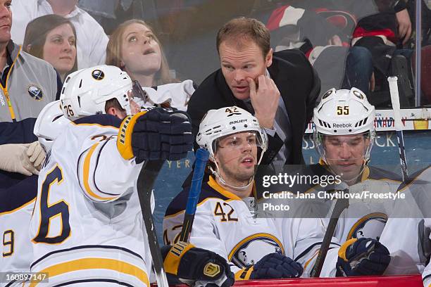 Assistant coach Kevyn Adams of the Buffalo Sabres talks with player Thomas Vanek of the Buffalo Sabres during an NHL game against the Ottawa Senators...