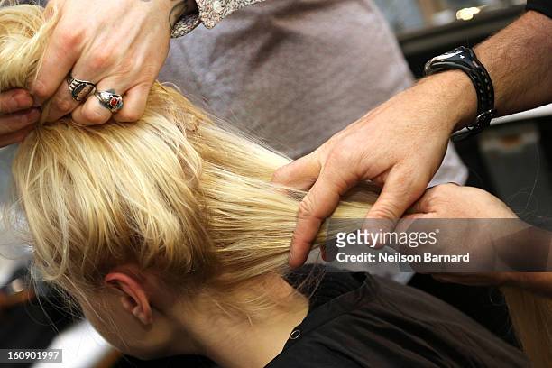 Rodney Cutler, Redken Expert And Celebrity Runway Stylist For THE SALON At Ulta Beauty Backstage styles models hair at The Tadashi Shoji Fall 2013...