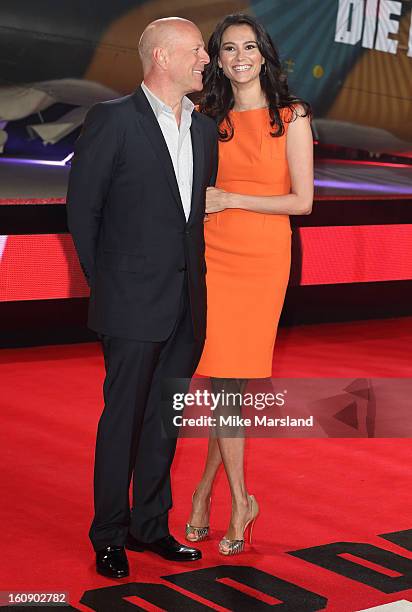 Bruce Willis and Emma Heming attend the UK premiere of "A Good Day To Die Hard" at Empire Leicester Square on February 7, 2013 in London, England.