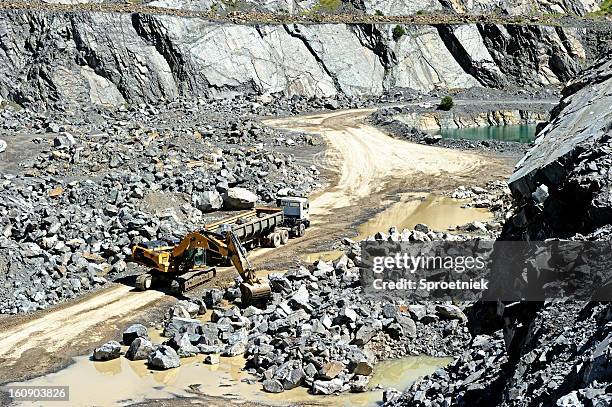 truck loaded in open pit gravel mine - mine workings stock pictures, royalty-free photos & images