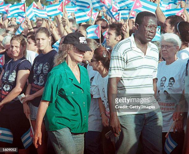 Dalia Soto del Valle walks with an unidentified friend during a political rally July 7, 2001 in Bejucal Town, outside of Havana, Cuba. Soto del Valle...