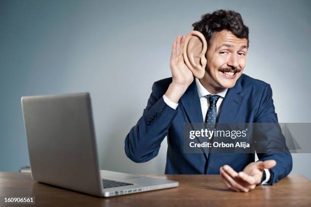 businessman with big ear - human ear stock pictures, royalty-free photos & images