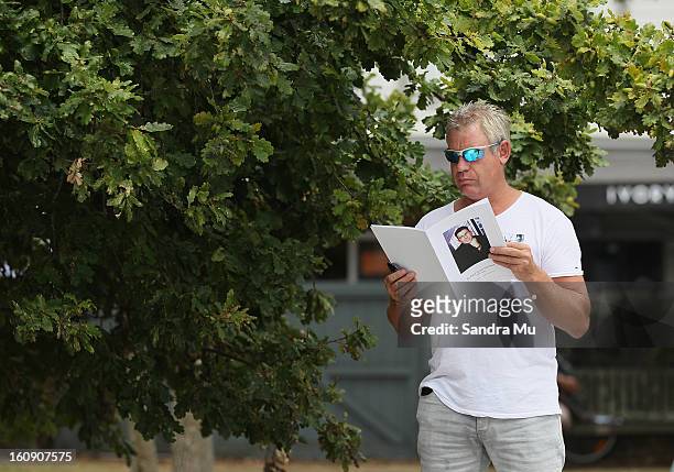 Member of the public reads a programme outside Auckland Cathedral of the Holy Trinity in Parnell on February 8, 2013 in Auckland, New Zealand....