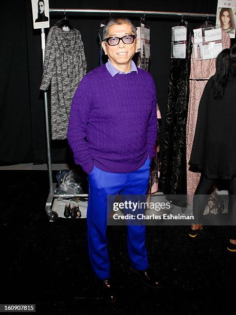 Fashion designer Tadashi Shoji preps backstage at the Tadashi Shoji Fall 2013 Mercedes-Benz Fashion Show at The Stage at Lincoln Center on February...