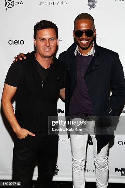 Designer Sergio Davila and Eric West pose backstage at the Sergio Davila Fall 2013 fashion show during Mercedes-Benz Fashion Week at The Studio at...