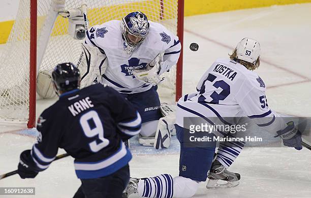 James Reimer of the Toronto Maple Leafs blocks a shot on goal in a game against the Winnipeg Jets during first-period action on February 7, 2013 at...