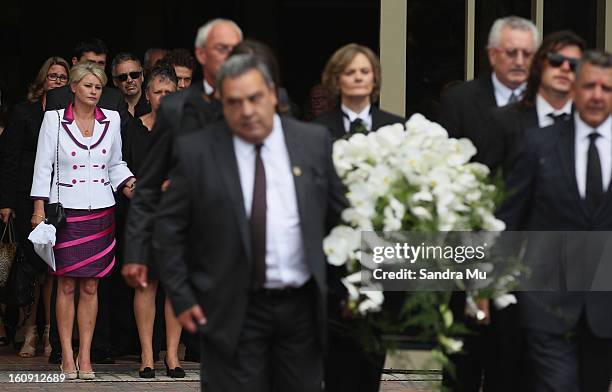 Deborah Holmes, wife of Sir Paul Holmes follows the casket out of the service at Auckland Cathedral of the Holy Trinity in Parnell on February 8,...