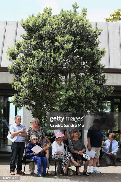 Public gather to watch the live screening outside Auckland Cathedral of the Holy Trinity in Parnell on February 8, 2013 in Auckland, New Zealand....