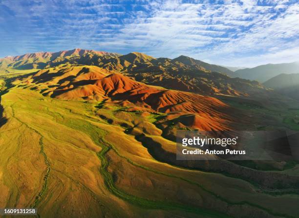 aerial view of mountain landscape  in kyrgyzstan at sunset. - silk road photos et images de collection