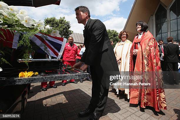 The coffin for Sir Paul Holmes is placed inside the hearse at Auckland Cathedral of the Holy Trinity in Parnell on February 8, 2013 in Auckland, New...