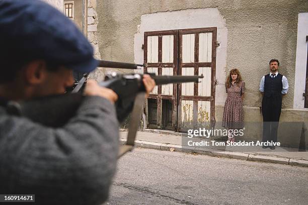 English actress Felicity Montagu as Nicole Dissard faces a firing squad in the British TV drama series 'Wish Me Luck', 1990.