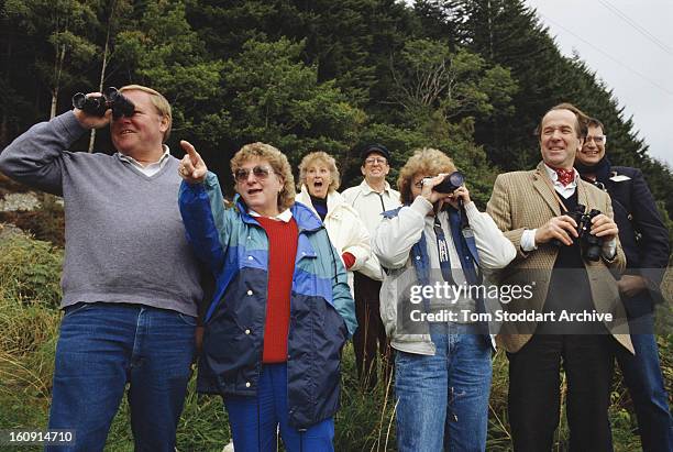 Tourists searching for the fabled Loch Ness Monster by Loch Ness in the Scottish Highlands, 1993.
