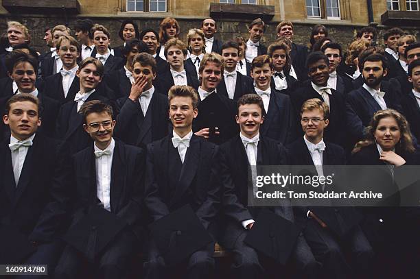 Students have their official class photograph taken after graduating from Oxford University, UK, October 1988.