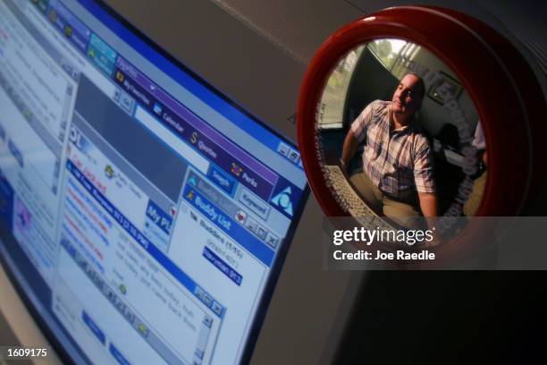 Special Agent Don Condon from the Florida Department of Law Enforcement uses an AOL account on his computer August 14, 2001 to bring online...