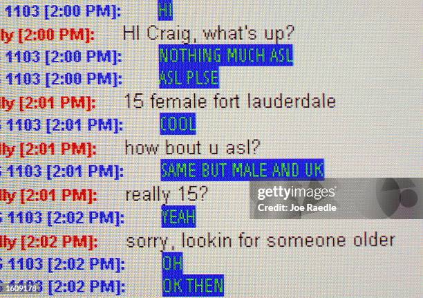 Special Agent Don Condon from the Florida Department of Law Enforcement receives an instant message on his AOL account August 14, 2001 at the Broward...