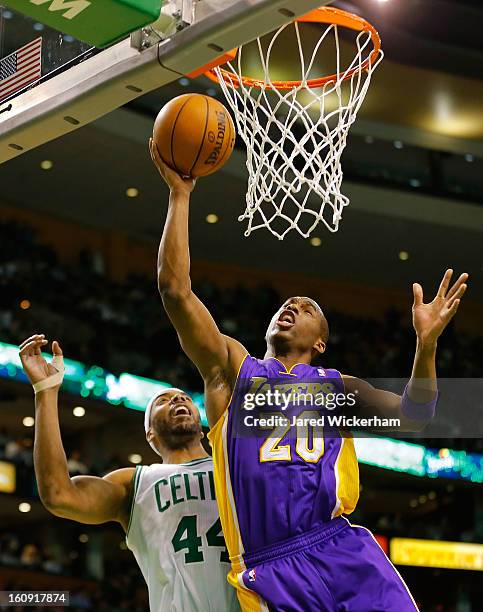 Jodie Meeks of the Los Angeles Lakers goes up for a layup in front of Chris Wilcox of the Boston Celtics during the game on February 7, 2013 at TD...