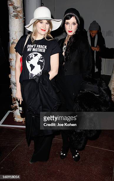 Musician/actress Tennessee Thomas and Sophie Flicker stand backstage at the Edun Fall 2013 fashion show during Mercedes-Benz Fashion Week at Skylight...