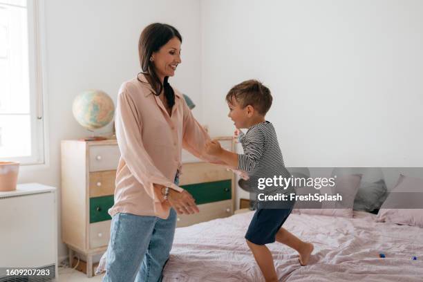 happy caucasian mother and son spending quality time together - hot wife stockfoto's en -beelden