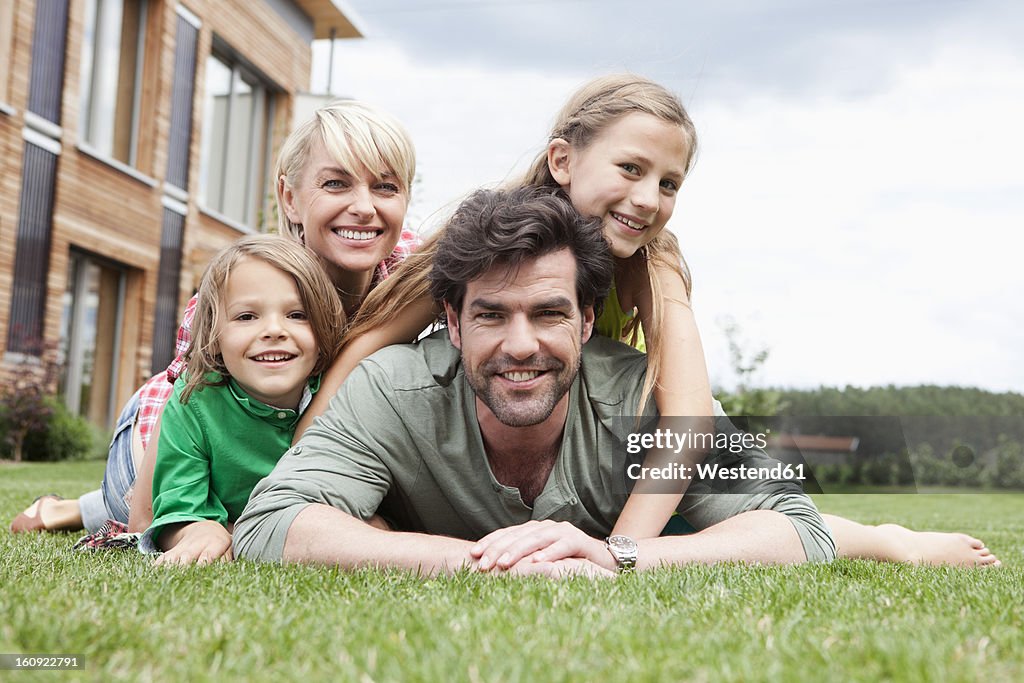 Germany, Bavaria, Nuremberg, Portrait of family in front of house