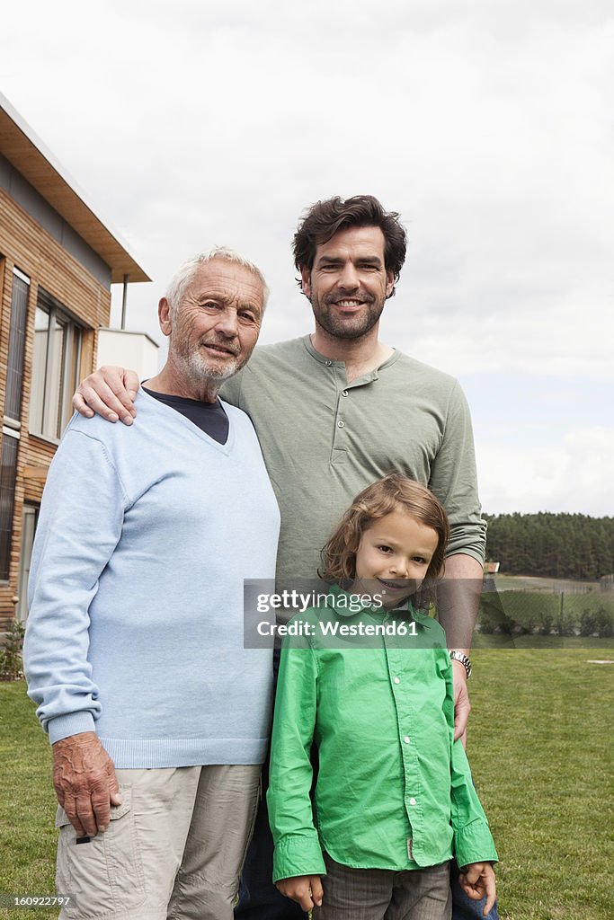 Germany, Bavaria, Nuremberg, Portrait of family in front of house