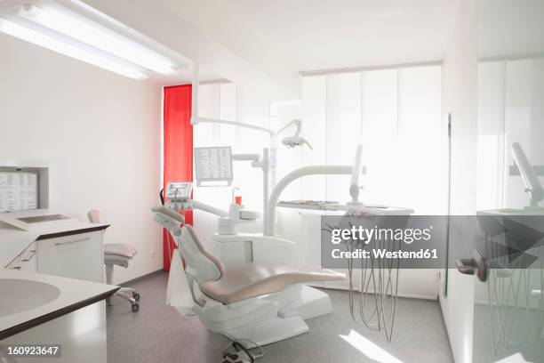germany, dentist chair and equipment in dental office - zahnarztstuhl stock-fotos und bilder