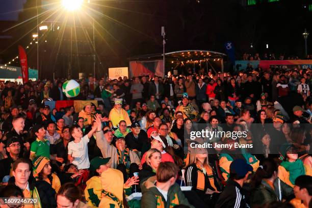 Matildas fans at the Sydney FIFA Fan Festival throw a beach ball as they watch the Matildas FIFA World Cup Game, being played in Brisbane, on August...