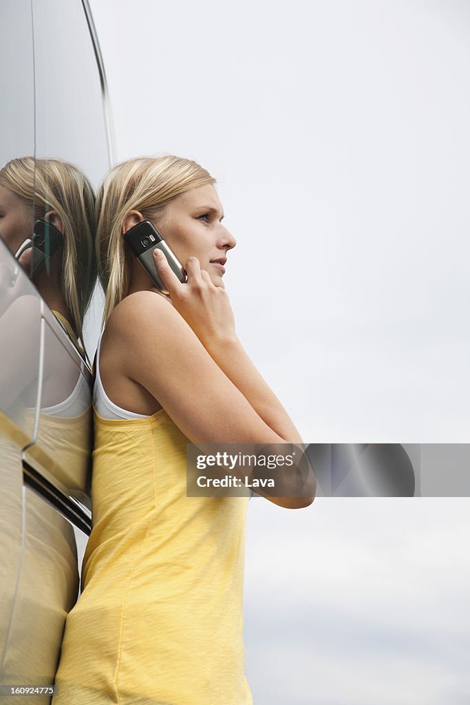 Portrait of young woman talking on mobile phone