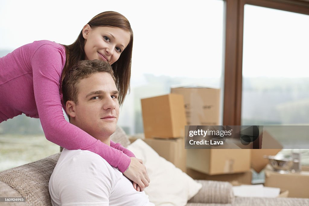 Portrait of young couple in new flat