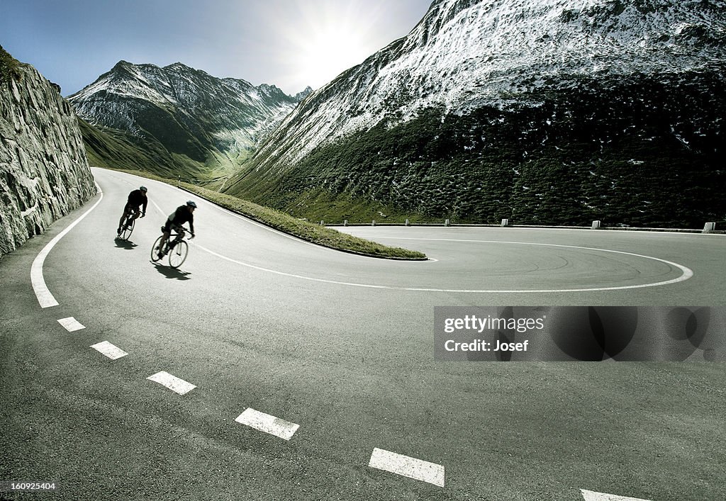 Two cyclists on mountain road