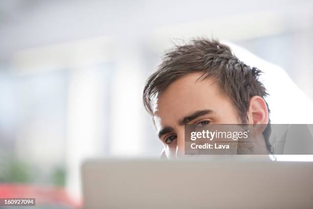 Hiding Behind Computer Screen Photos and Premium High Res Pictures ...