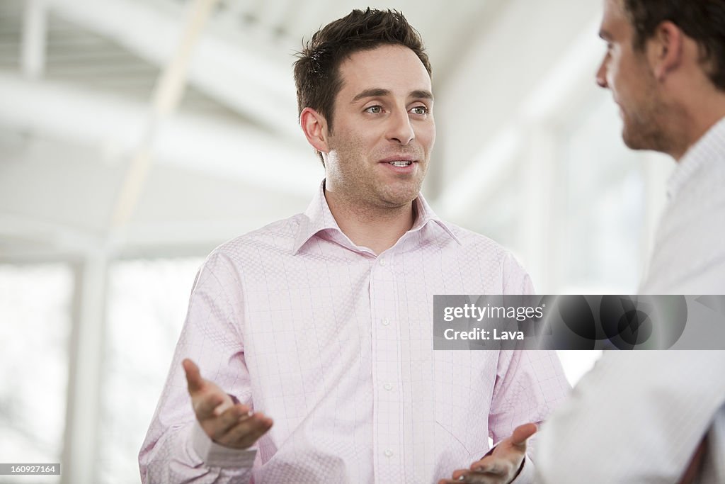 Two businessmen having discussion