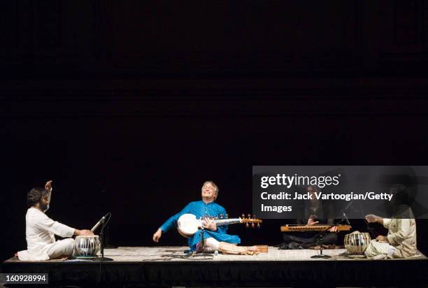 Indian musician Amjad Ali Khan plays sarod , with tabla players Sukvinder Singh and Samir Chatterjee , and Benaifer Bhada on drone surmandal ,...