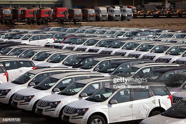 Rows of Mahindra & Mahindra Ltd. XUV 500 sport utility vehicles are parked in a stock yard at the company's factory in Chakan, Maharashtra, India, on...