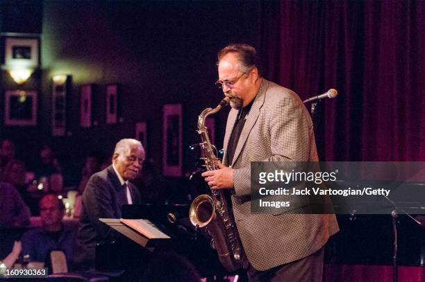 American jazz musician Joe Lovano, on tenor saxophone, leads his quartet at Birdland, New York, New York, April 8, 2009. Pianist Hank Jones is at...