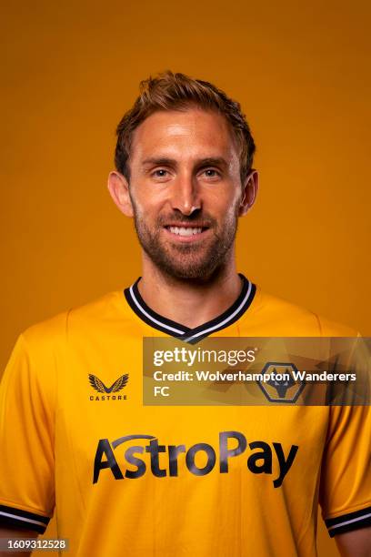 Craig Dawson of Wolverhampton Wanderers poses for a portrait in the 2023/24 Home Kit during media access day at Molineux on August 03, 2023 in...