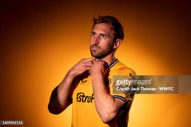 Craig Dawson of Wolverhampton Wanderers poses for a portrait in the 2023/24 Home Kit during media access day at Molineux on August 03, 2023 in...