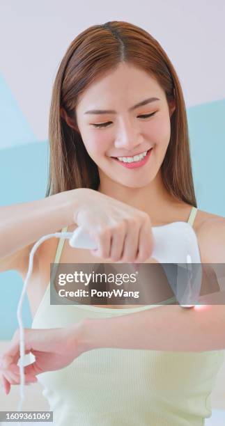 girl laser arm hair - absence stock pictures, royalty-free photos & images