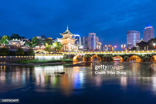 aerial view of cityscape and landmark jiaxiu tower in guiyang at night - guiyang stockfoto's en -beelden