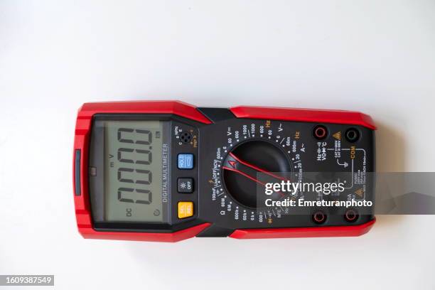 high angle view of a multimeter on white background. - multimeter stock pictures, royalty-free photos & images
