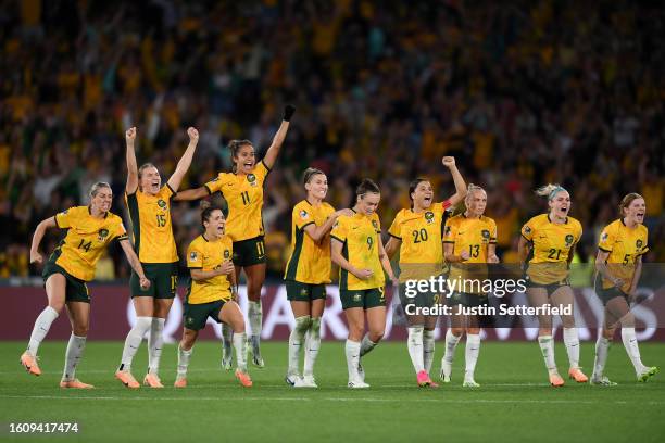 Players of Australia celebrate as Mackenzie Arnold of Australia saves the first penalty of France from Selma Bacha of France in the penalty shoot out...