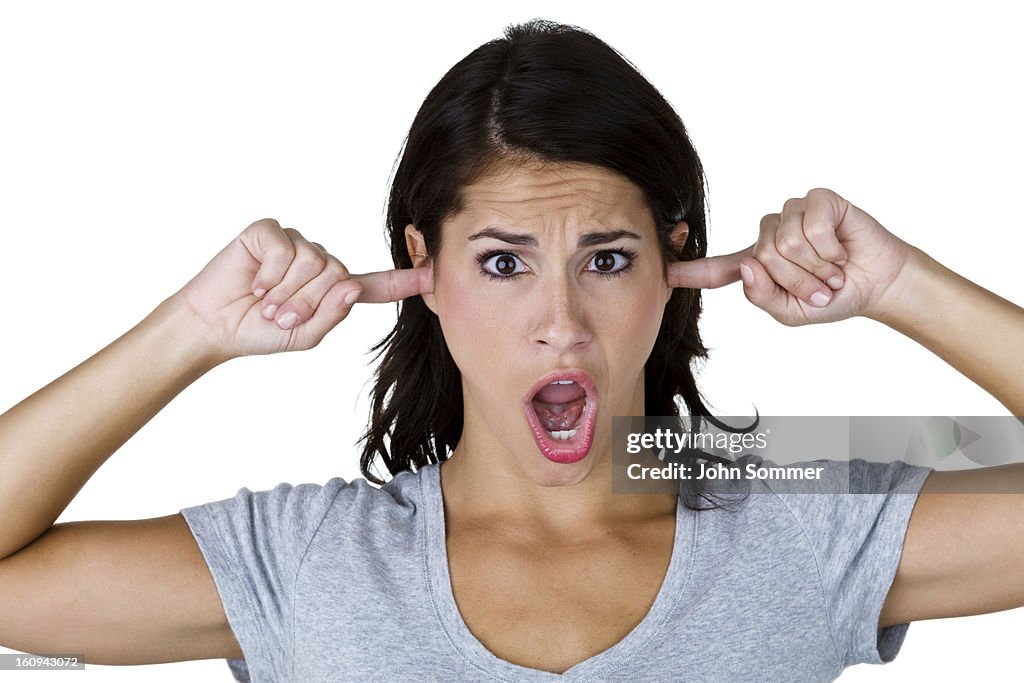 Woman with fingers in her ears