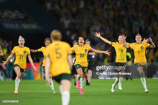 Players of Australia celebrate their side's victory in the penalty shoot out after Cortnee Vine of Australia scores her team's tenth penalty in the...