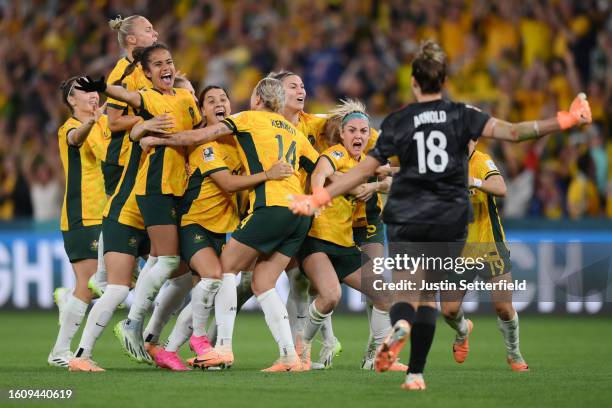 Players of Australia celebrate their side's victory in the penalty shoot out after Cortnee Vine of Australia scores her team's tenth penalty in the...